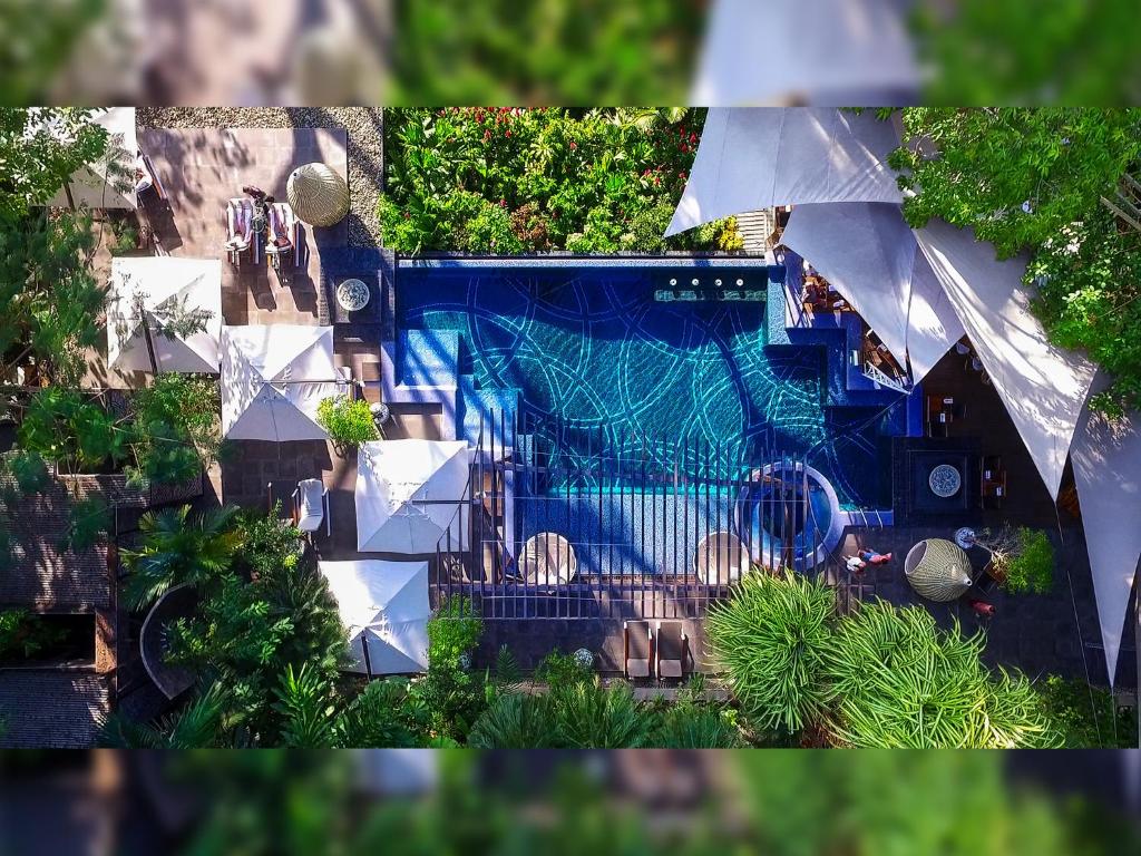 an overhead view of a swimming pool in a yard at Makanda by The Sea Hotel Adults Only in Manuel Antonio