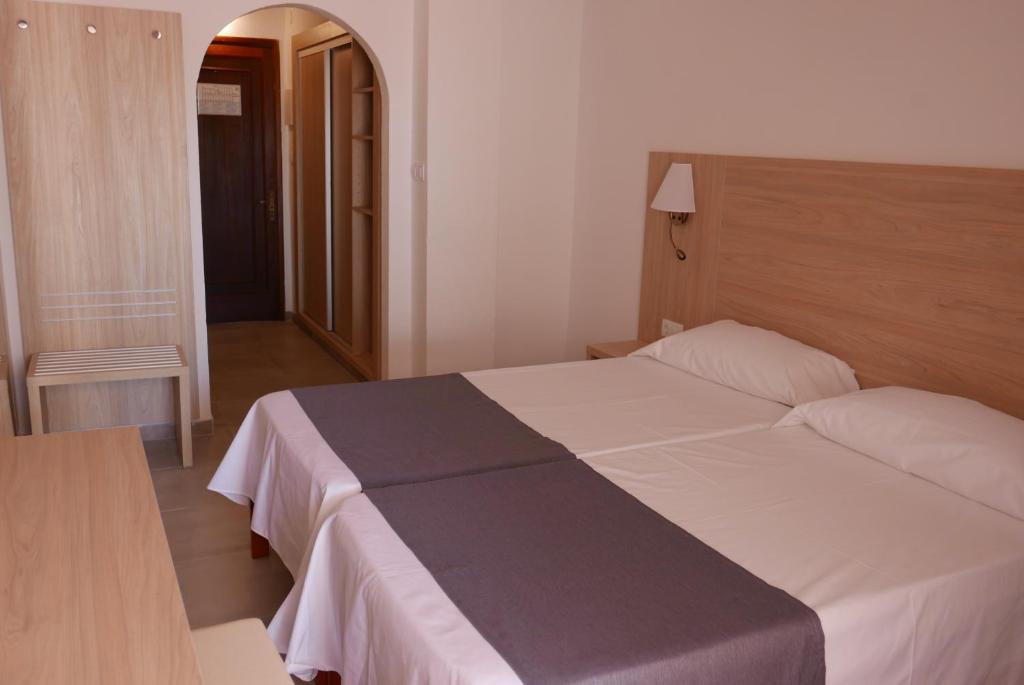 Кровать или кровати в номере Hotel Antares