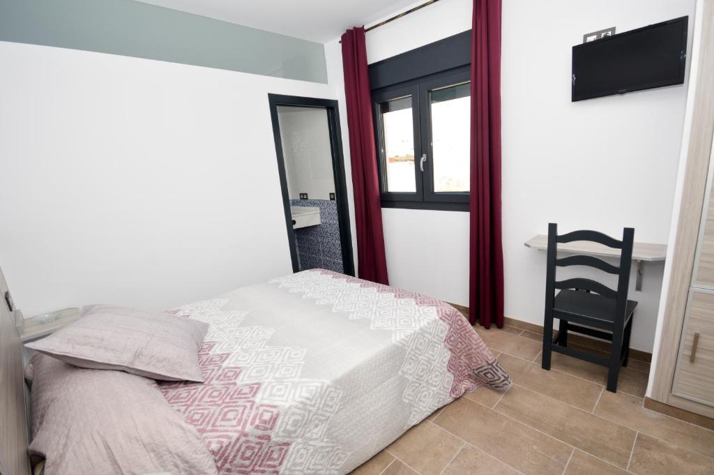 Posteľ alebo postele v izbe v ubytovaní Hostal Maria Jose
