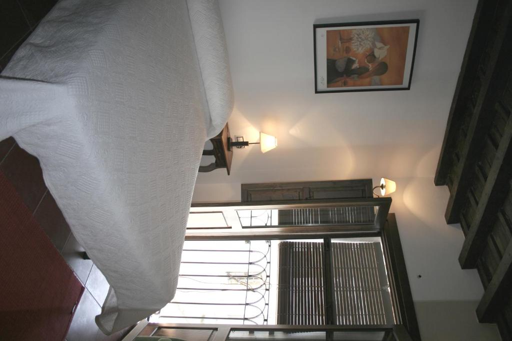Cama o camas de una habitación en Apartamentos Rurales Víctor Chamorro del Arco