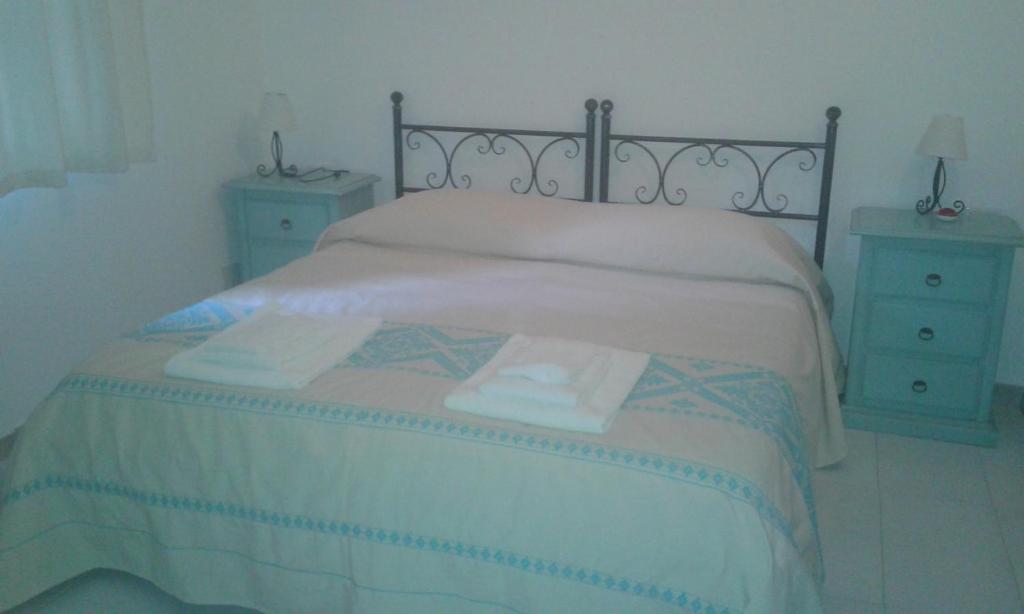 Postel nebo postele na pokoji v ubytování B&B S'Archiotta