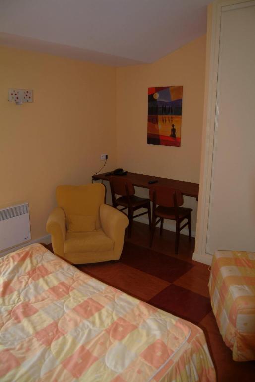 Postel nebo postele na pokoji v ubytování Hôtel Bertrand