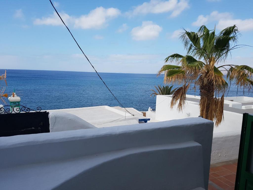 a view of the ocean from the balcony of a house at Casa Tito in Puerto del Carmen