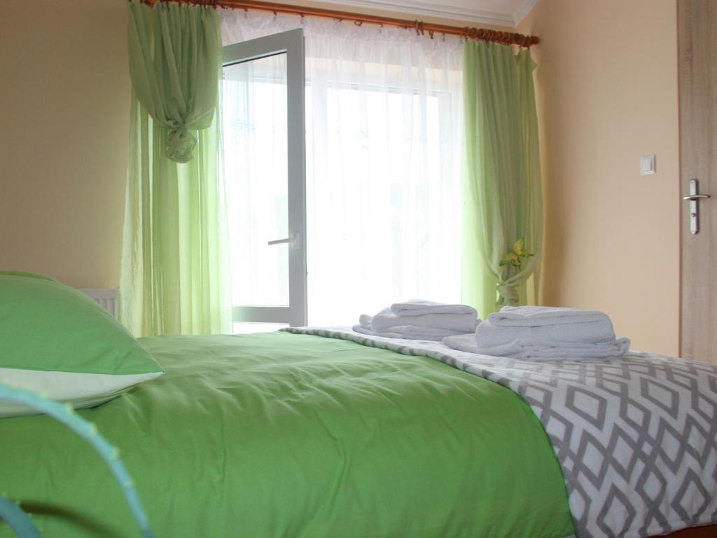 Postel nebo postele na pokoji v ubytování Orlikowe Wzgórze