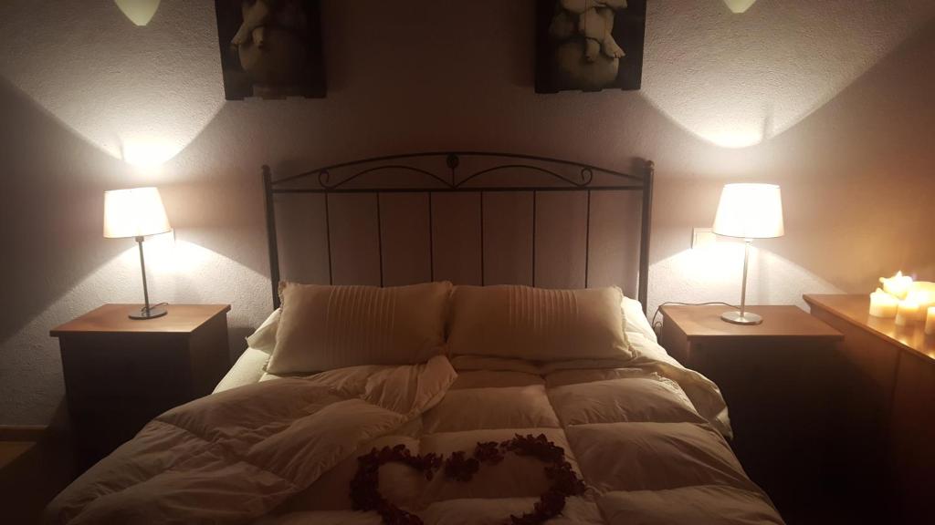 En eller flere senge i et værelse på Loboratorio Rural-La Sonrisa del Aire