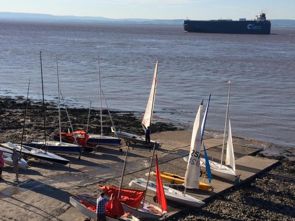 a group of sailboats lined up on the shore at The Nook @ Drop Anchor in Portishead
