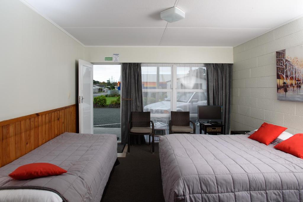 Postel nebo postele na pokoji v ubytování Kauri Lodge Motel
