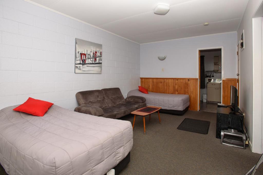 Postel nebo postele na pokoji v ubytování Kauri Lodge Motel