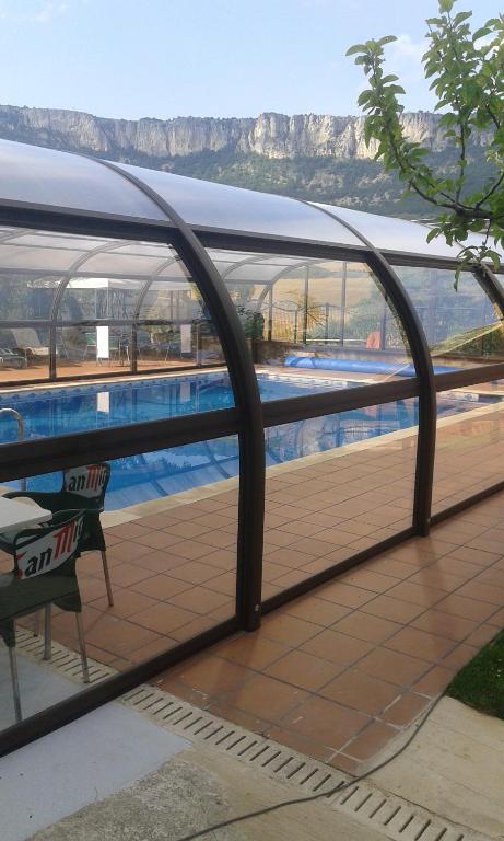 a balcony with a view of a swimming pool at Casa Rural Landa in Galbarra