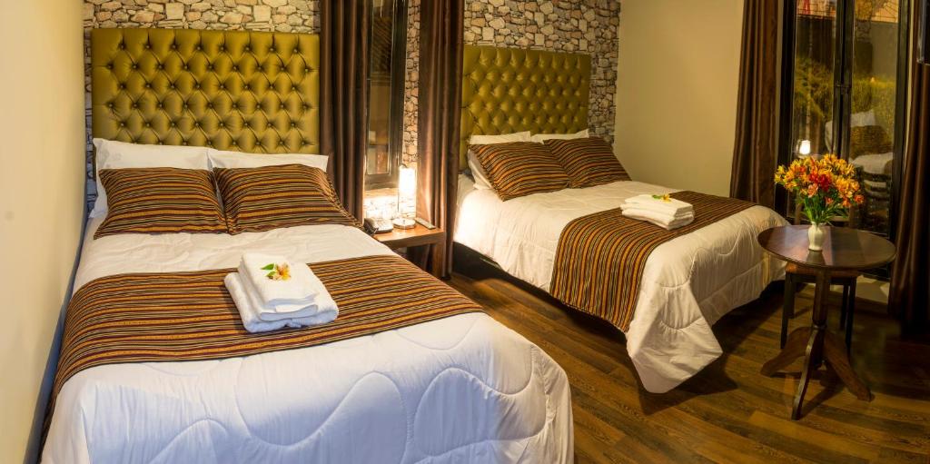Katil atau katil-katil dalam bilik di Ureta Hotel