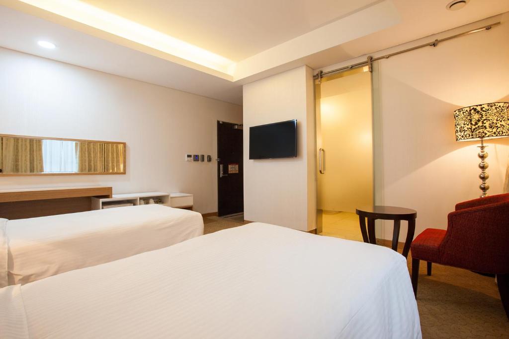 Postel nebo postele na pokoji v ubytování Hotel Pharos