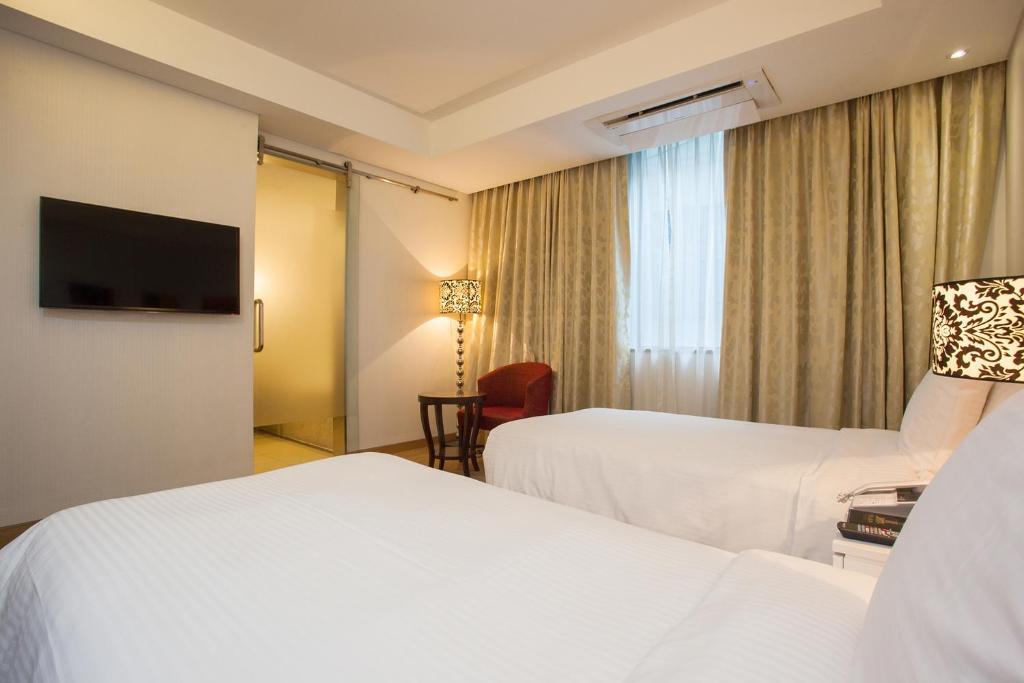 Postel nebo postele na pokoji v ubytování Hotel Pharos