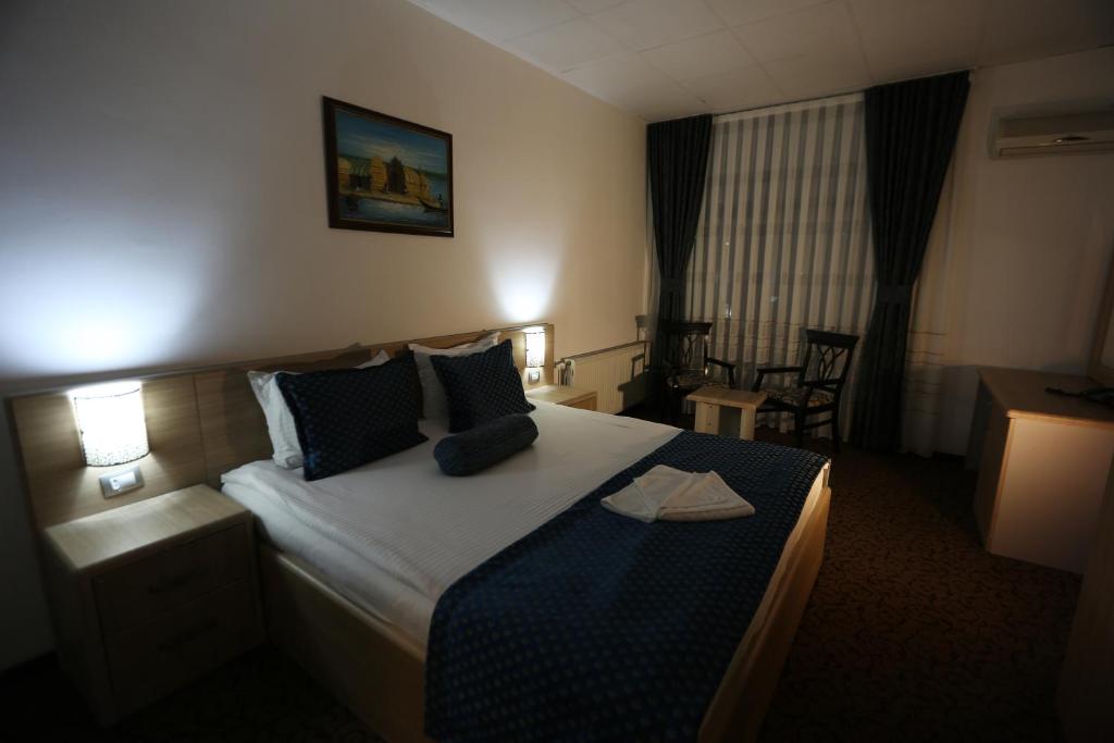 Postel nebo postele na pokoji v ubytování Hotel Pejton