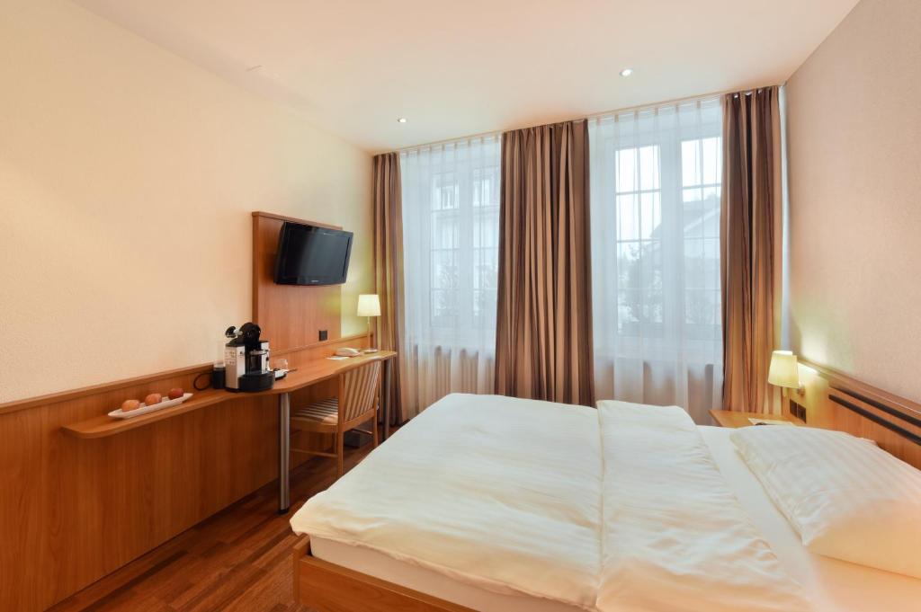 Postel nebo postele na pokoji v ubytování Apart Hotel Amadeo