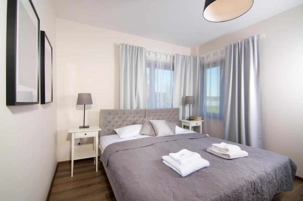 Ένα ή περισσότερα κρεβάτια σε δωμάτιο στο Marine Rooms