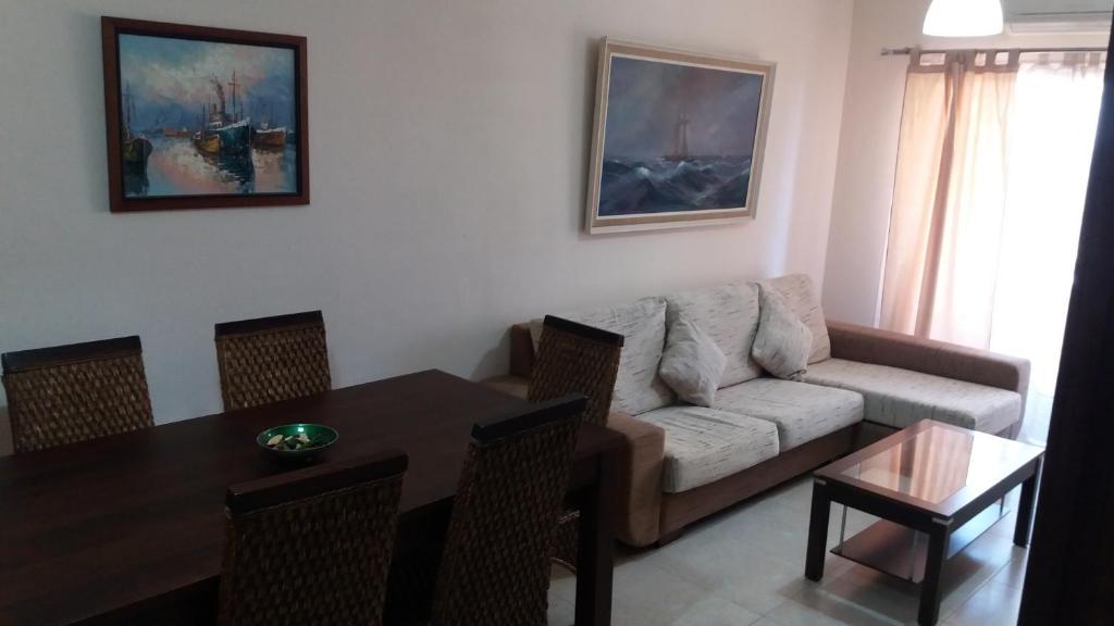 a living room with a couch and a table at vivienda vacacional Maravillosa in Candelaria