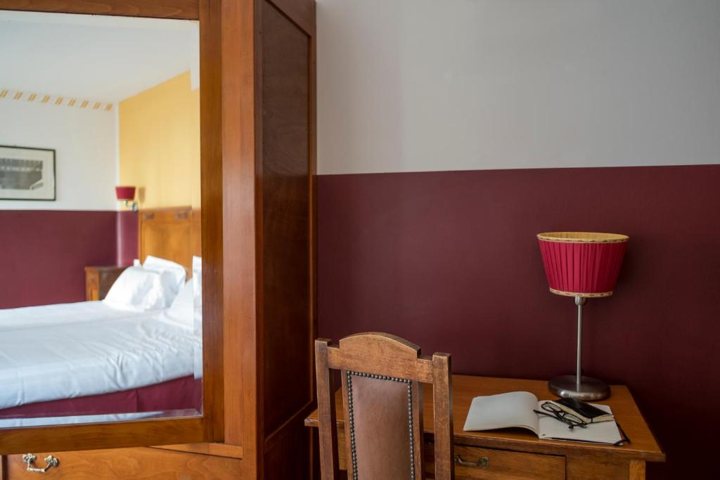 Postel nebo postele na pokoji v ubytování Antico Hotel Vicenza