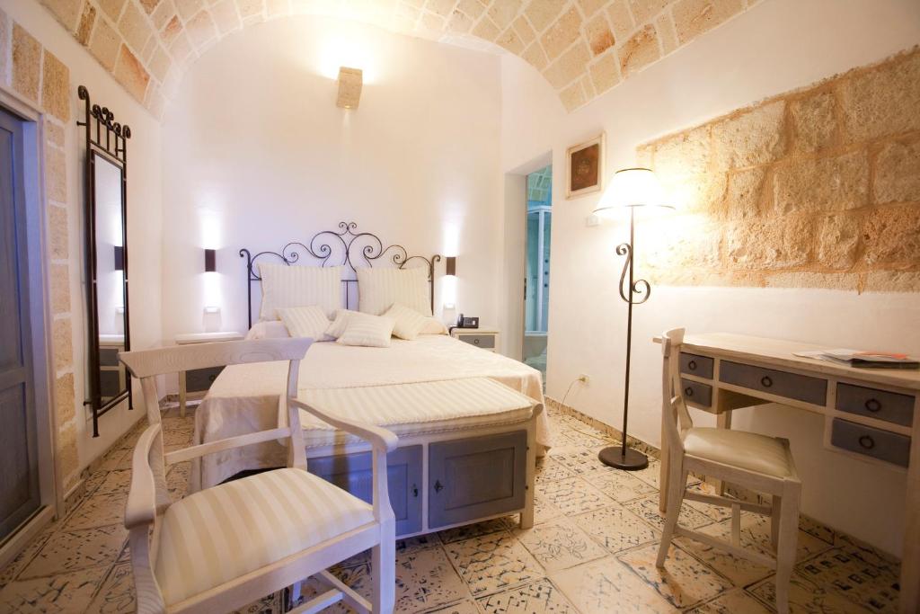 Postel nebo postele na pokoji v ubytování Masseria Bosco & Masseria Strazzati