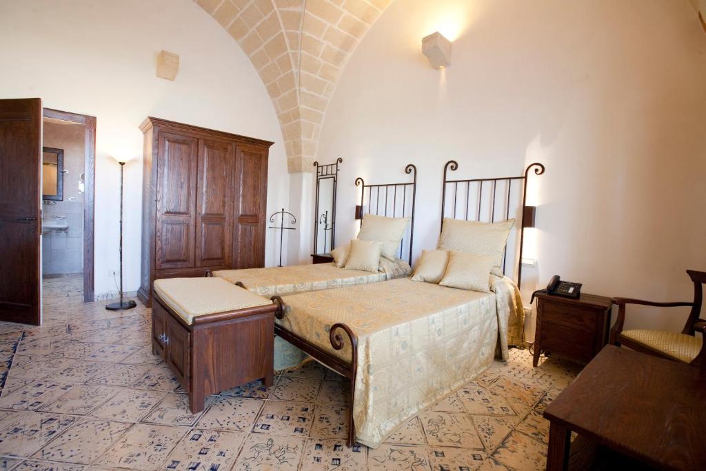Postel nebo postele na pokoji v ubytování Masseria Bosco & Masseria Strazzati