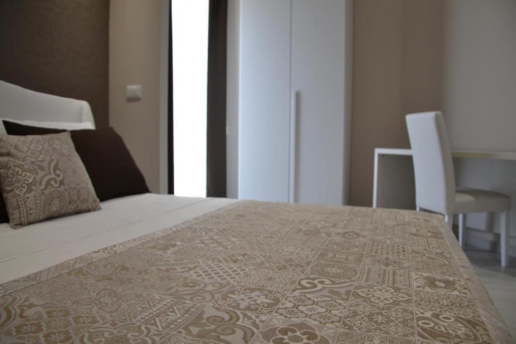 Postel nebo postele na pokoji v ubytování B&B Terra d'Oriente