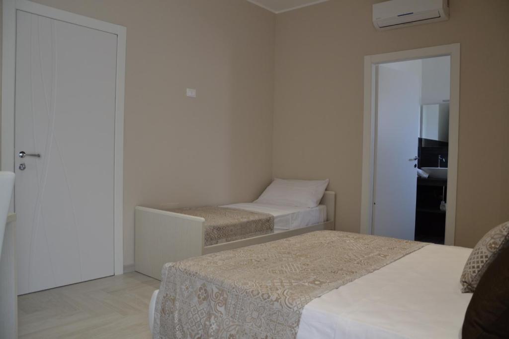 Postel nebo postele na pokoji v ubytování B&B Terra d'Oriente