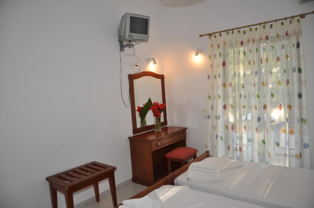 Postel nebo postele na pokoji v ubytování Hotel Dougas