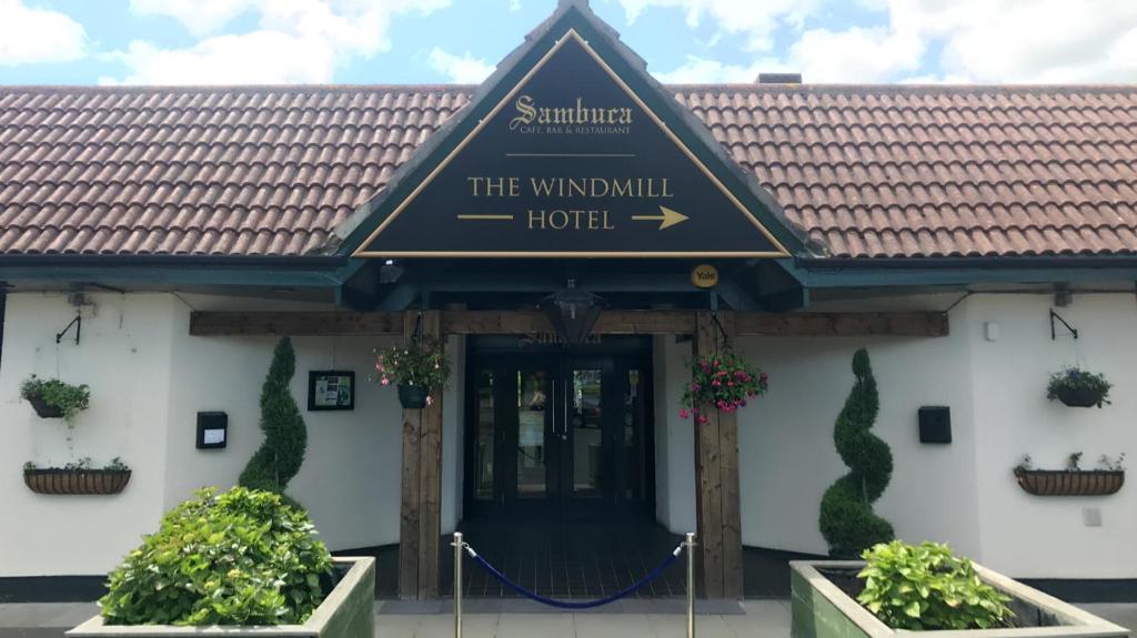 a building with a sign that reads the windmill hotel at The Windmill Hotel in Elwick