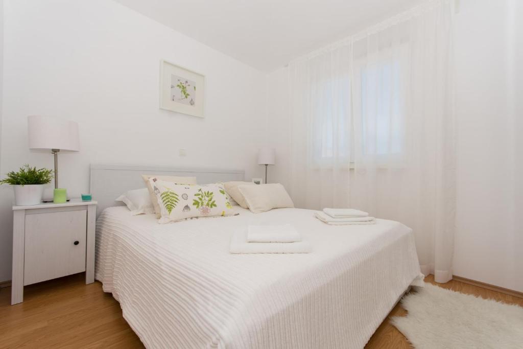 Postel nebo postele na pokoji v ubytování Apartment Flynn