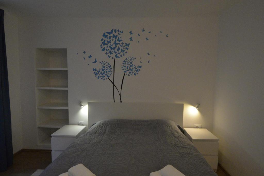 Postel nebo postele na pokoji v ubytování Apartments and Rooms Oliva