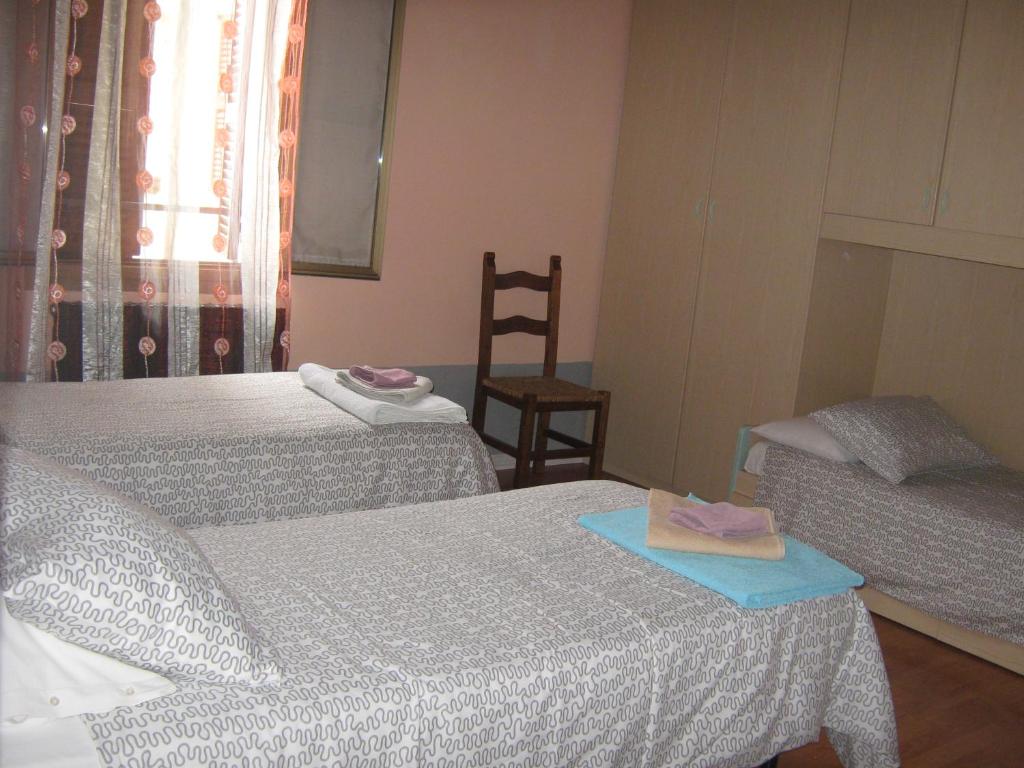 Postel nebo postele na pokoji v ubytování Albergo Sangalli