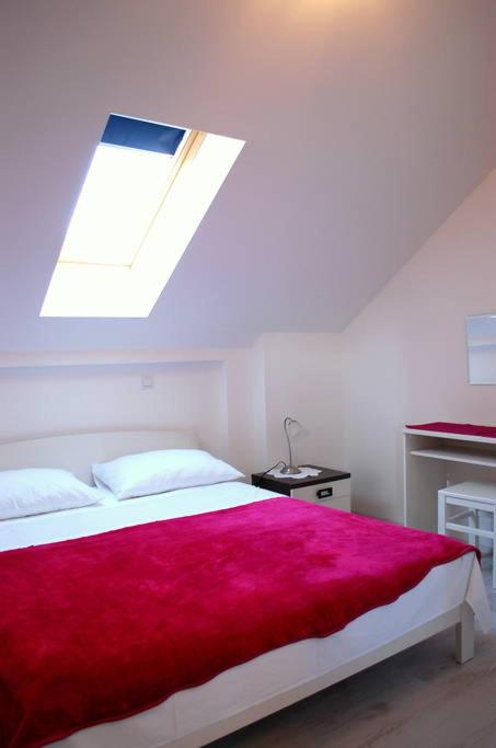 Een bed of bedden in een kamer bij Villa Violić