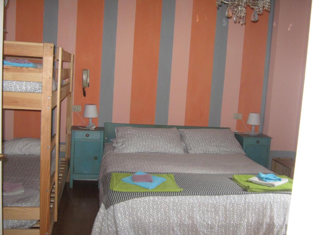 Postel nebo postele na pokoji v ubytování Albergo Sangalli