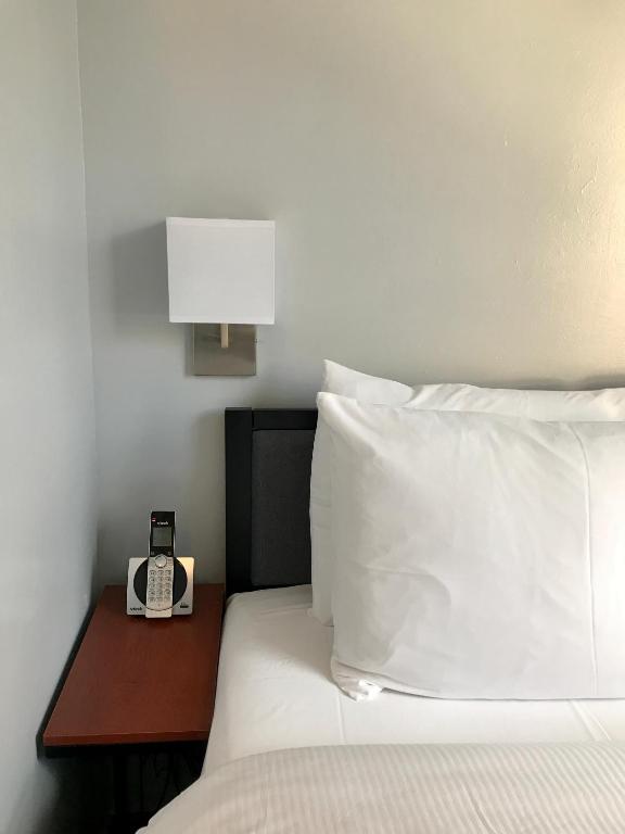 Posteľ alebo postele v izbe v ubytovaní Hotel Mimosa