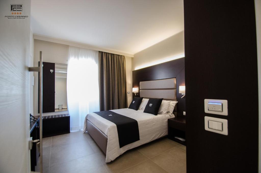 Postel nebo postele na pokoji v ubytování Porto Cesareo Exclusive Room