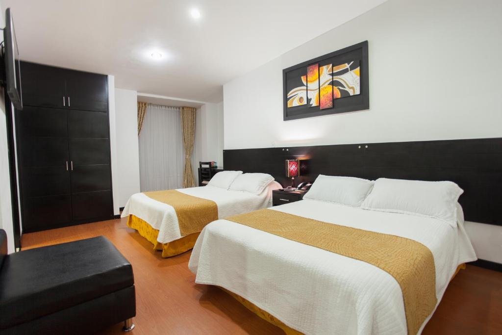 Postel nebo postele na pokoji v ubytování Hotel Palermo Suite