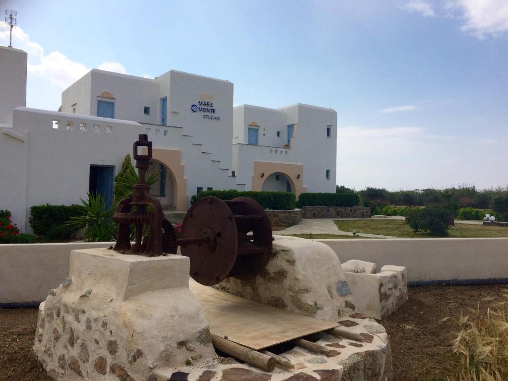 a statue in front of a building at Mare Monte Studios Naxos in Plaka