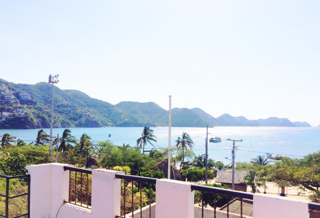 a view of the ocean from a balcony at Hotel San Marcos Taganga in Taganga