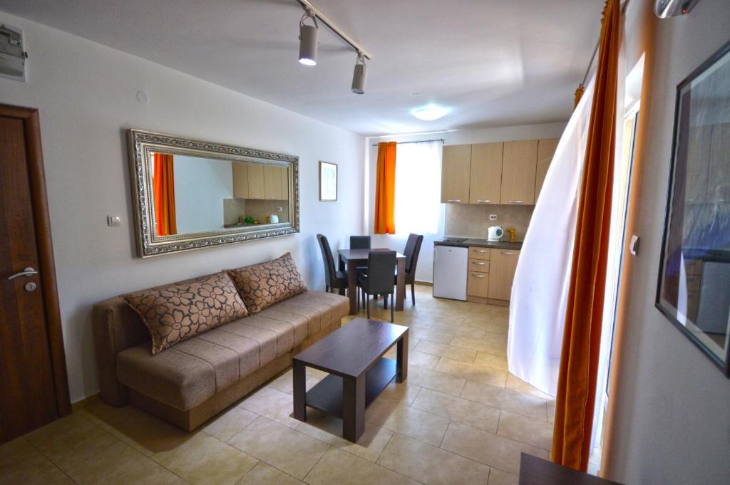 a living room with a couch and a table at Apartmani Kovačević in Kotor
