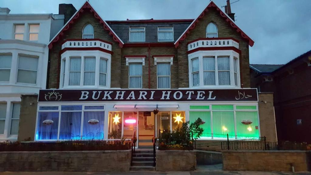 a building with a bulkin hotel in front of it at BUKHARI Hotel in Blackpool