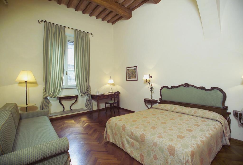 Postel nebo postele na pokoji v ubytování Hotel Fortuna