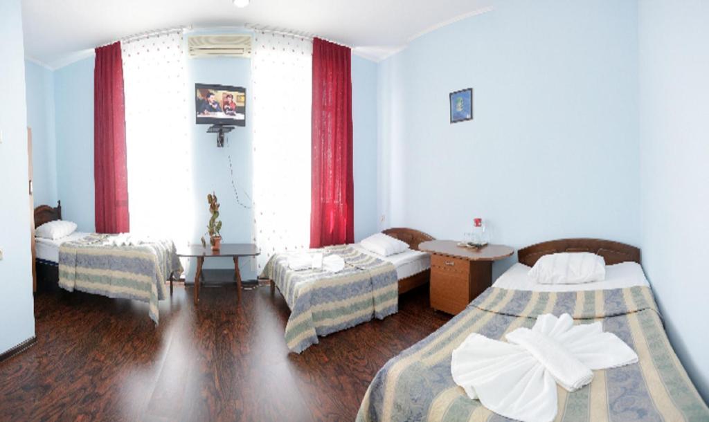 Postel nebo postele na pokoji v ubytování Europa Hotel-Kutaisi