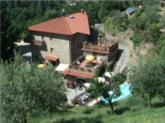 an aerial view of a house with a swimming pool at Hotel Archimede in Reggello