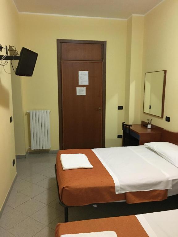 Cama o camas de una habitación en Hotel Greco
