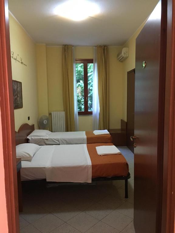 Cama o camas de una habitación en Hotel Greco