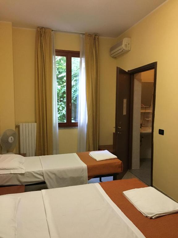 Cama o camas de una habitación en Hotel Greco
