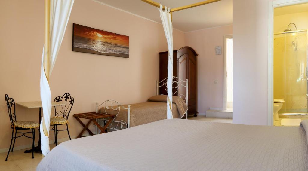 Posteľ alebo postele v izbe v ubytovaní B&B Dimora Muzio and Restaurant