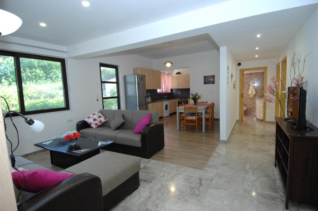 a living room with a couch and a table at Mountain view Holiday in Salakos, Rhodes in Sálakos