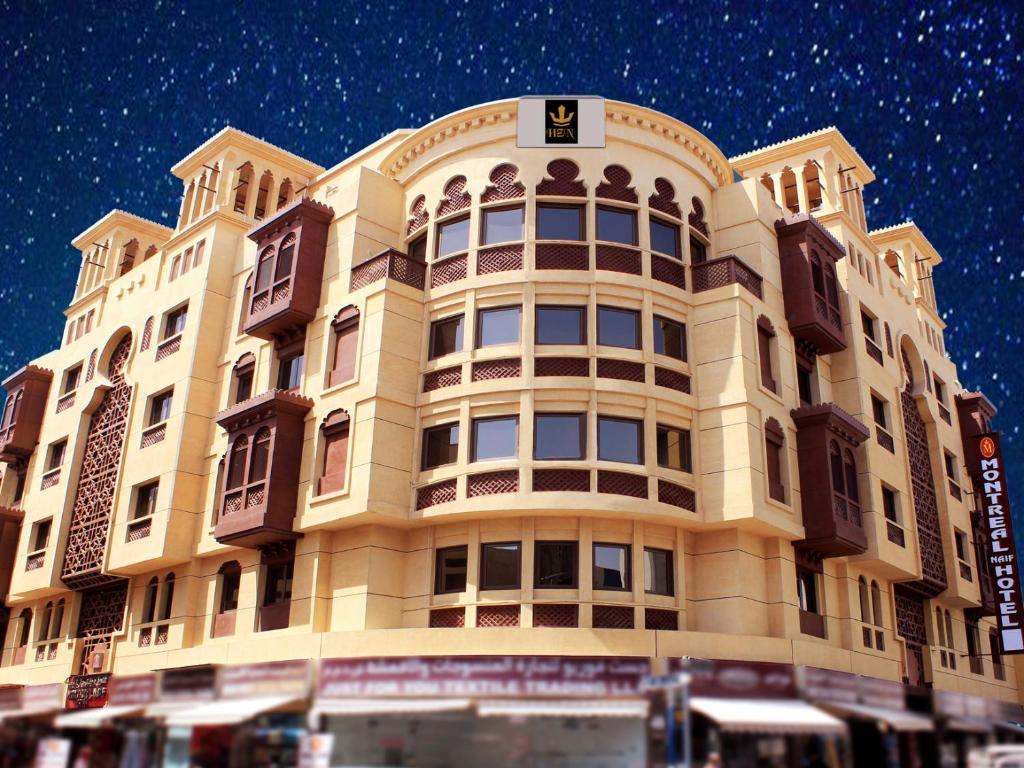 a large building with a lot of windows at Montreal Naif Hotel in Dubai