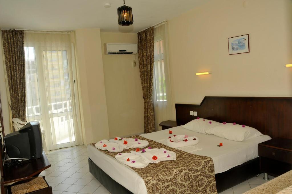 Postel nebo postele na pokoji v ubytování Bariscan Hotel