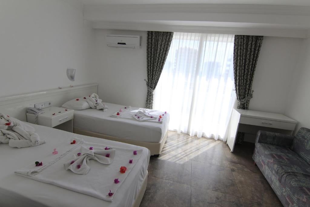 Postel nebo postele na pokoji v ubytování Bariscan Hotel